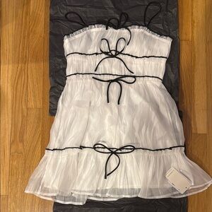 Black and white bow mini dress
